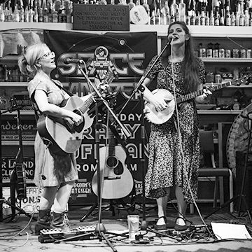 Beth Watts Nelson and Kelly Hunt performing on stage