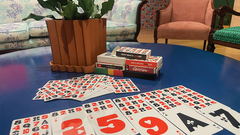 playing cards laid out on a coffee table