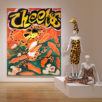 a large painting of a Cheetos bag hangs on the Nerman gallery wall