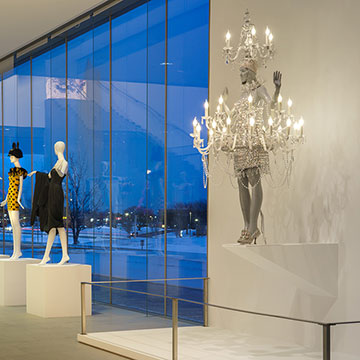 rows of mannequins displaying Jeremy Scott designs at the Nerman Museum - one is displaying the chandelier dress he designed for Katy Perry