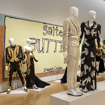 black and gold frocks designed by Jeremy Scott on display at the Nerman