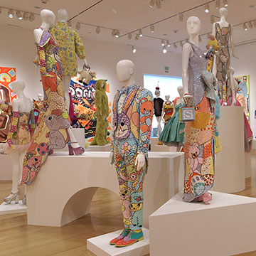 A view of the Match Made in Heaven exhibition showing mannequins with designs by Jeremy Scott